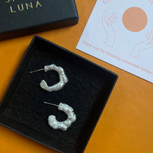 Load image into Gallery viewer, Molten silver hoops in box