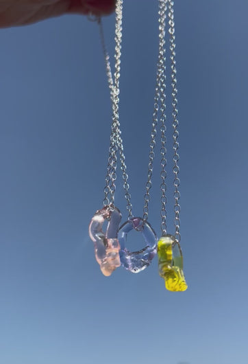Pink lilac and yellow molten pendants  blue sky 