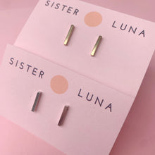 Load image into Gallery viewer, Brass and silver bar studs on pink earring cards
